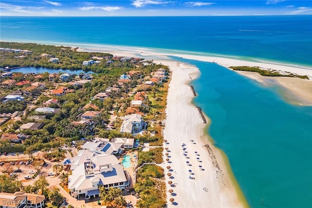 bird's eye view featuring a beach view and a water view