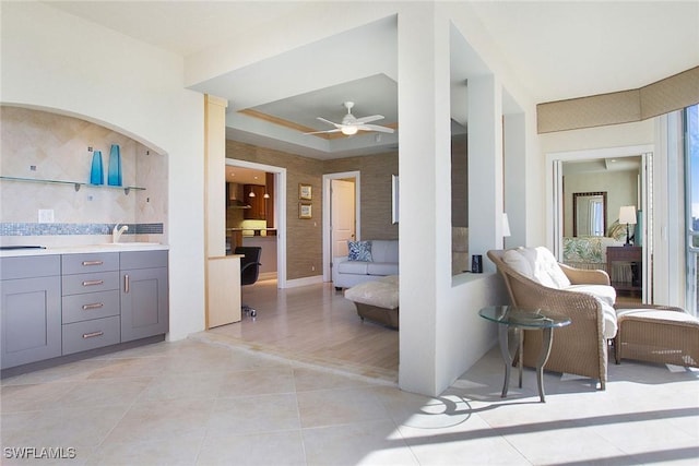 interior space with wood-type flooring, vanity, and ceiling fan