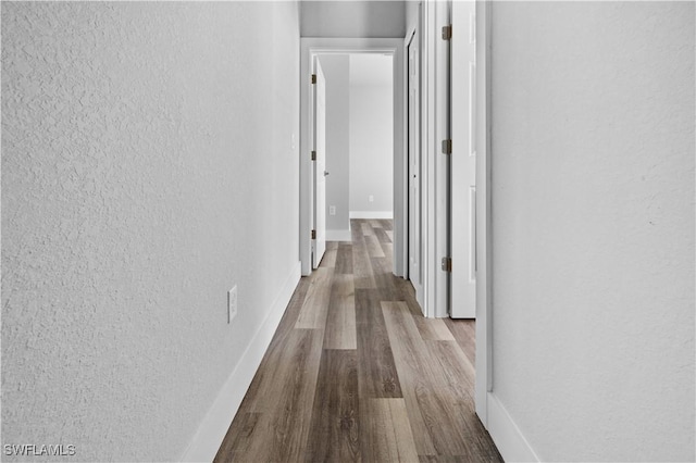 hallway with light wood-type flooring