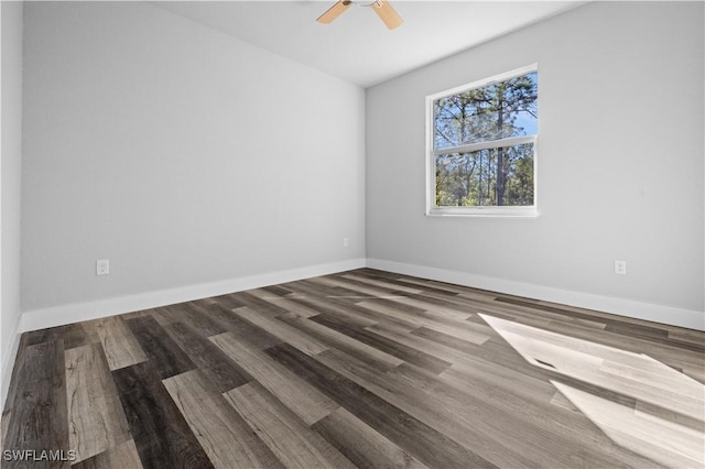 spare room with hardwood / wood-style floors and ceiling fan