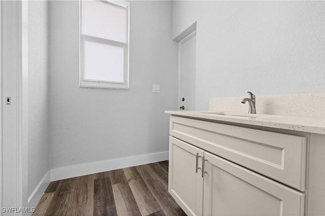 bathroom featuring vanity and hardwood / wood-style flooring