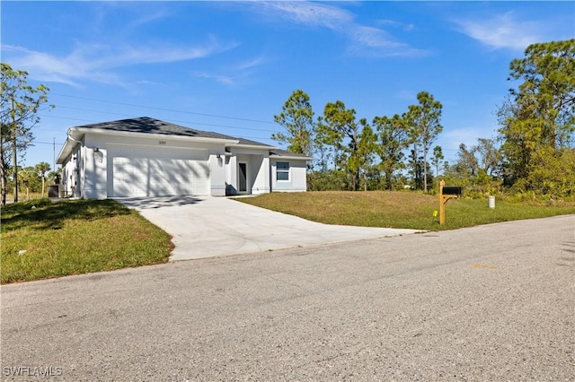 ranch-style home featuring a garage and a front yard