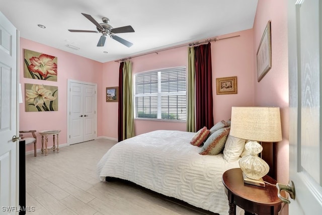 bedroom featuring a closet, ceiling fan, and light hardwood / wood-style floors