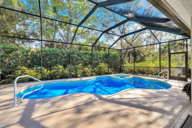 view of pool with a lanai and a patio