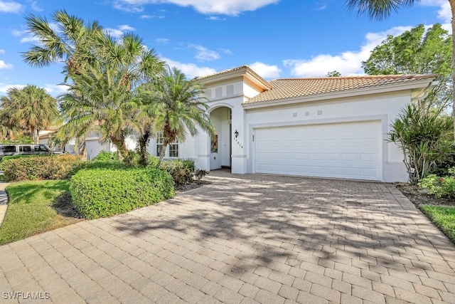 mediterranean / spanish-style home featuring a garage