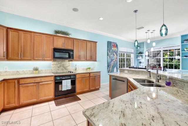 kitchen with black appliances, sink, hanging light fixtures, light stone countertops, and ornamental molding