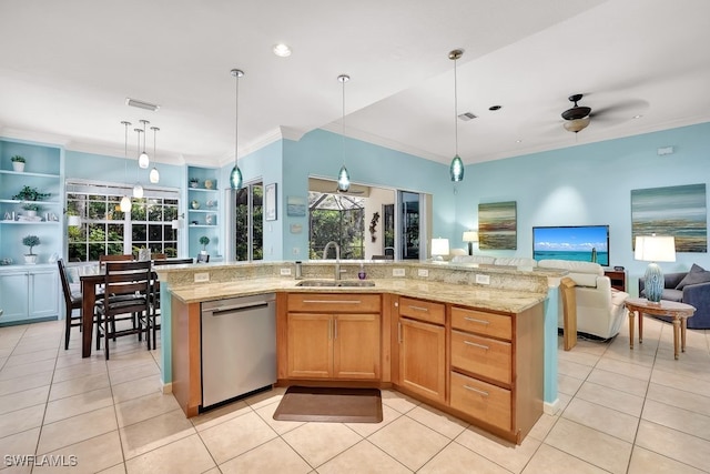 kitchen featuring stainless steel dishwasher, ceiling fan, sink, decorative light fixtures, and a center island with sink