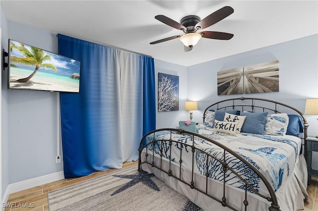 bedroom featuring ceiling fan and light wood-type flooring