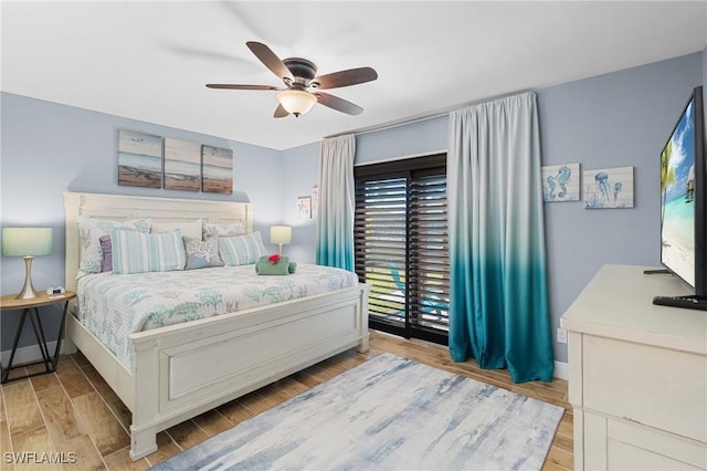 bedroom featuring light hardwood / wood-style floors and ceiling fan