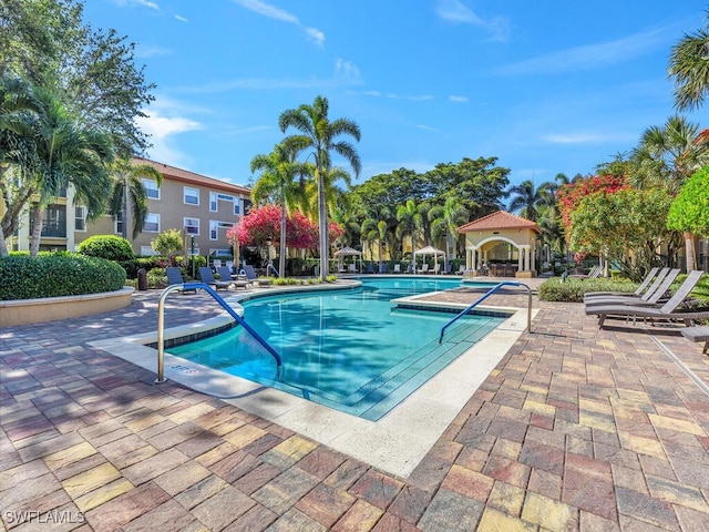 view of swimming pool featuring a patio area