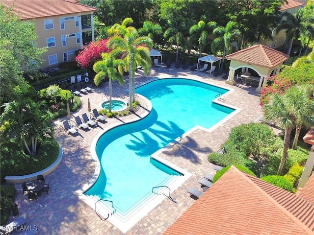 view of swimming pool featuring a gazebo and a patio area