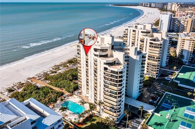 bird's eye view featuring a beach view and a water view