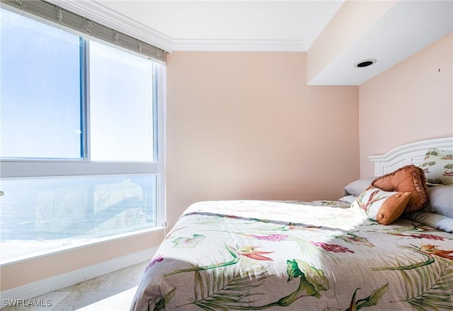 bedroom with multiple windows and ornamental molding