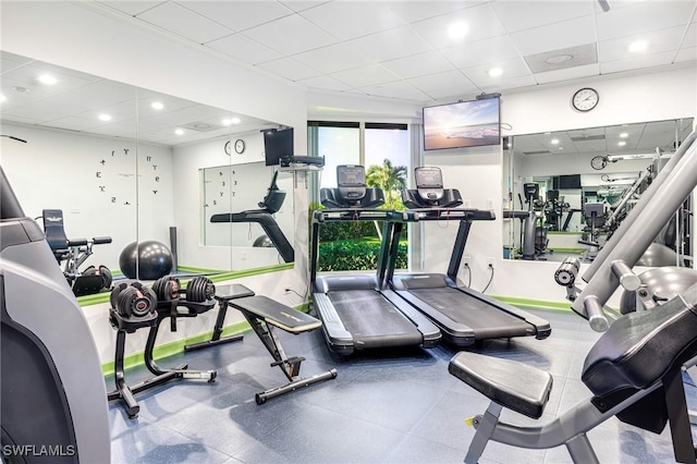 exercise room with a drop ceiling