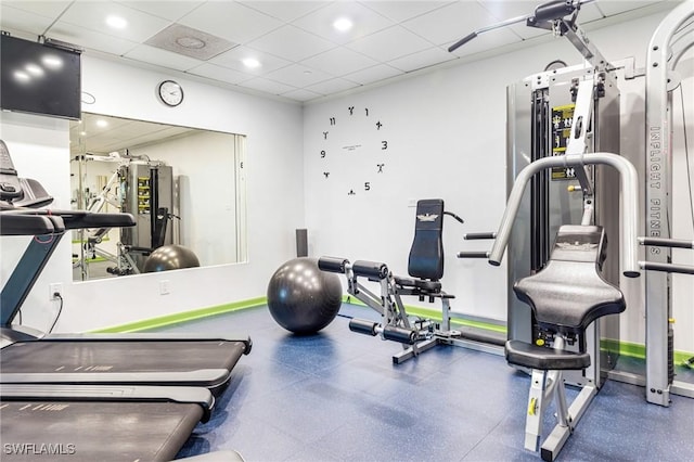 exercise room with a drop ceiling