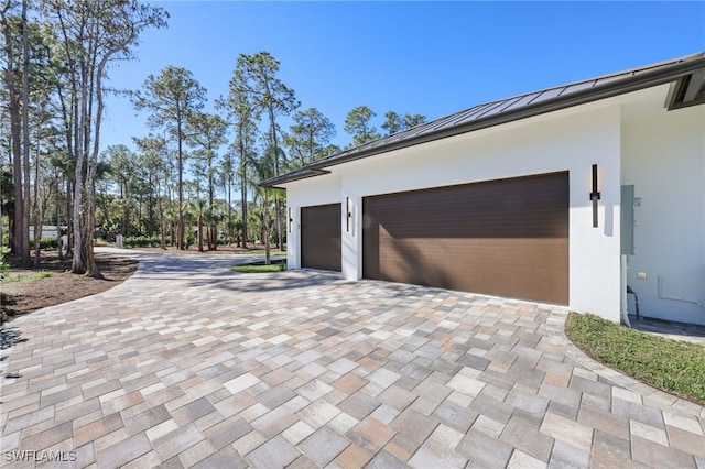 view of side of property featuring a garage