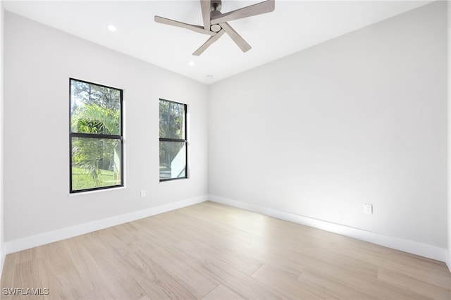 unfurnished room with light wood-type flooring and ceiling fan