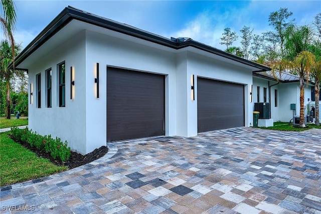 view of side of property with a garage