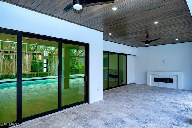 interior space featuring ceiling fan