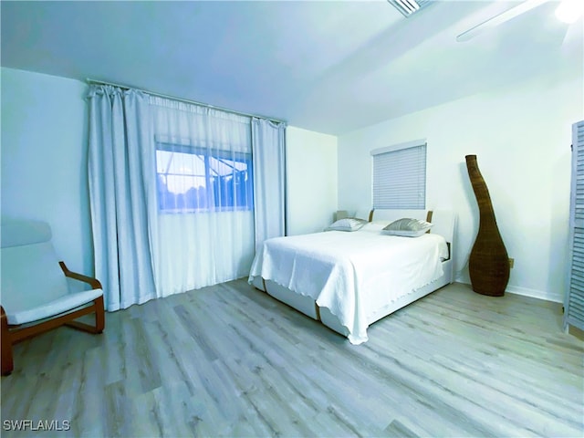 bedroom with light wood-type flooring