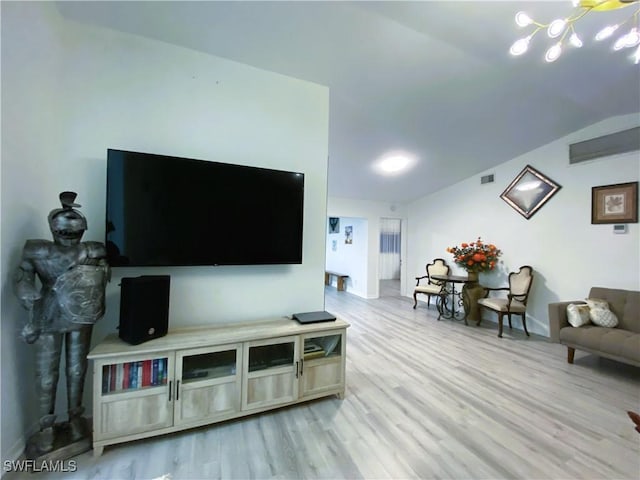 living room featuring visible vents and light wood-style floors