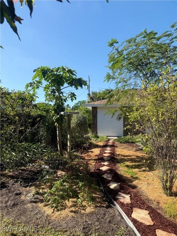 exterior space with an outbuilding and a shed