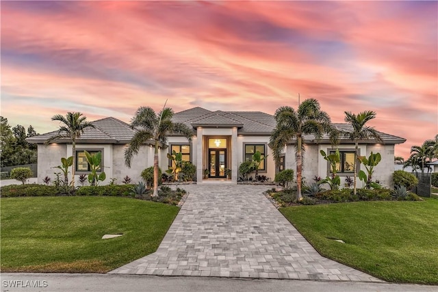 view of front of house with a lawn