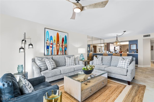 living room featuring ceiling fan