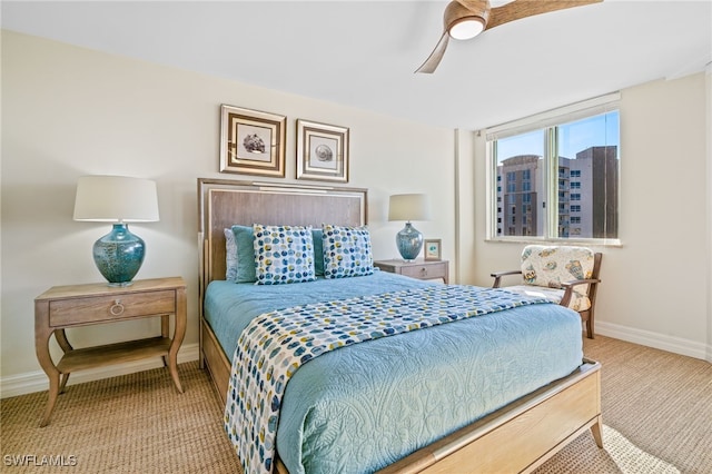 bedroom featuring light carpet and ceiling fan