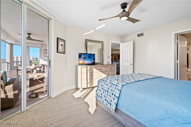 carpeted bedroom featuring access to exterior and ceiling fan