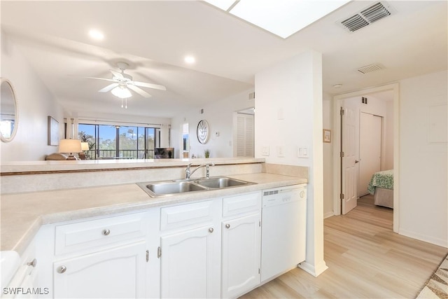 kitchen featuring dishwasher, white cabinets, sink, ceiling fan, and light hardwood / wood-style floors