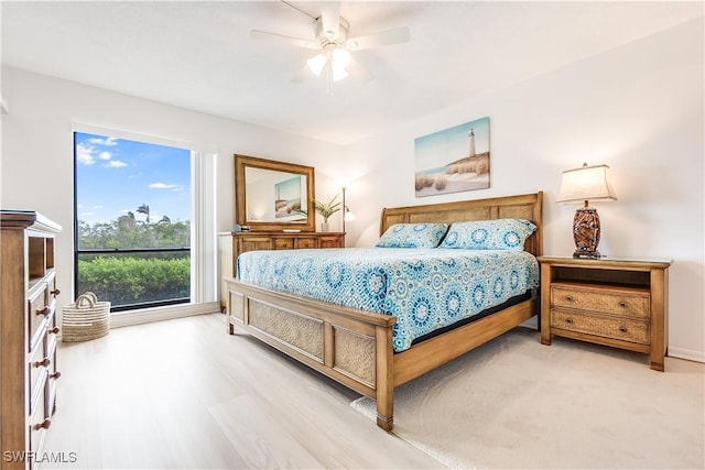 bedroom with wood-type flooring and ceiling fan