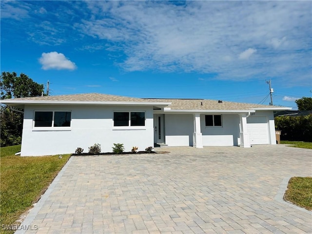 single story home featuring a garage