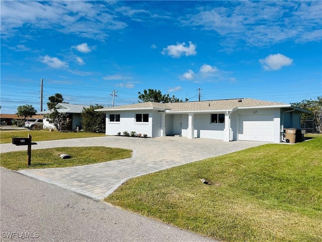 ranch-style house with a garage and a front yard