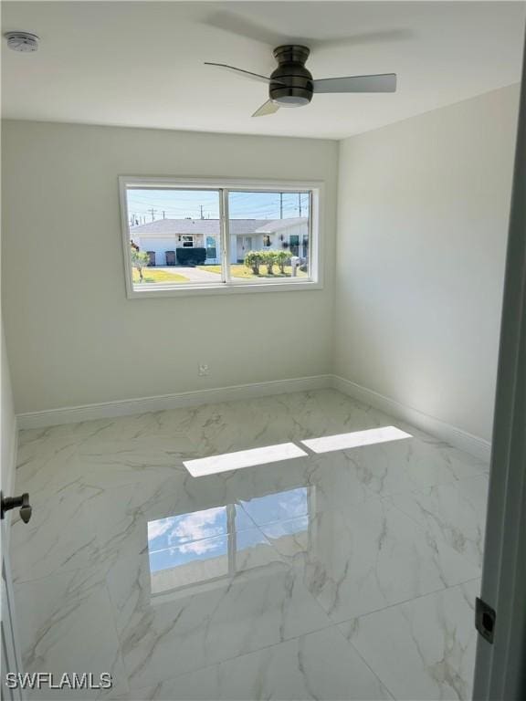 unfurnished room featuring ceiling fan