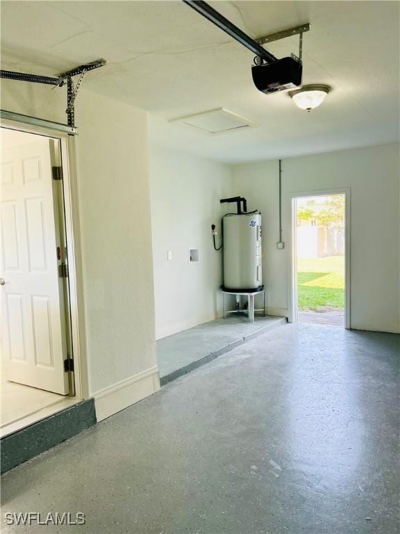 garage featuring gas water heater and a garage door opener