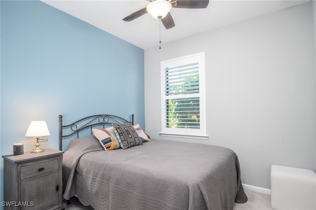 bedroom featuring ceiling fan and light colored carpet