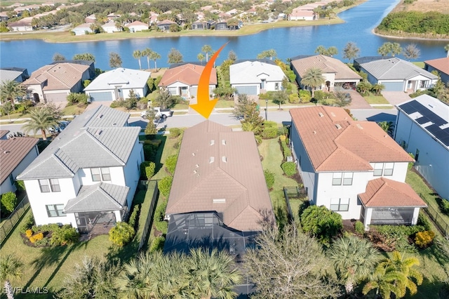 birds eye view of property with a water view