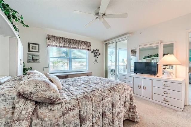 bedroom featuring ceiling fan, light carpet, and access to outside