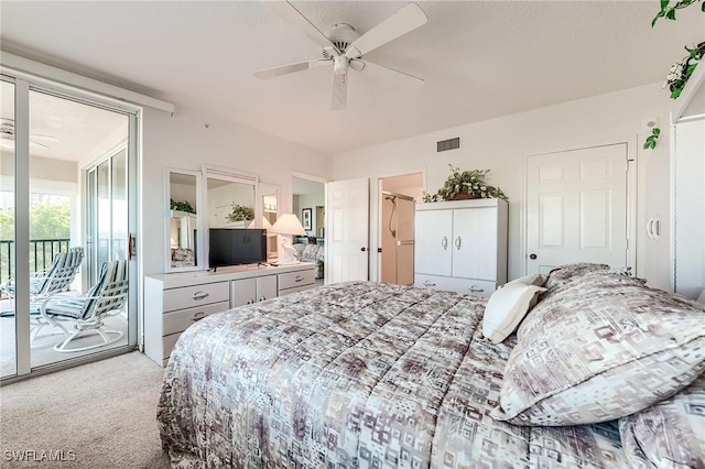 carpeted bedroom featuring ceiling fan and access to outside