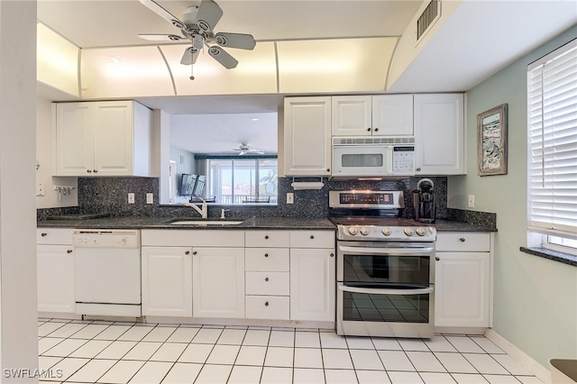 kitchen with white appliances, white cabinetry, ceiling fan, and sink