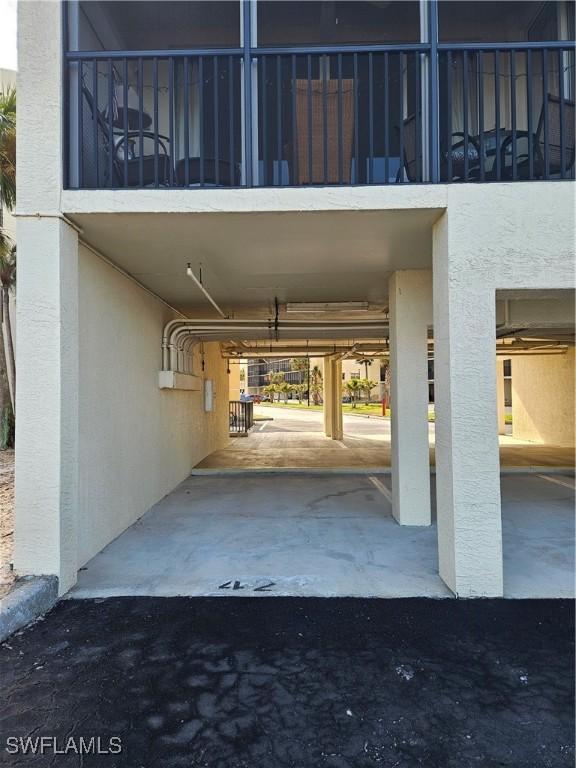 view of vehicle parking featuring a carport