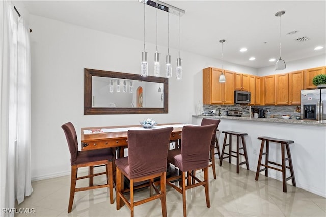 view of tiled dining room