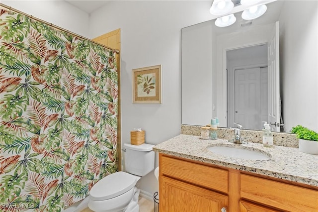 bathroom with vanity and toilet