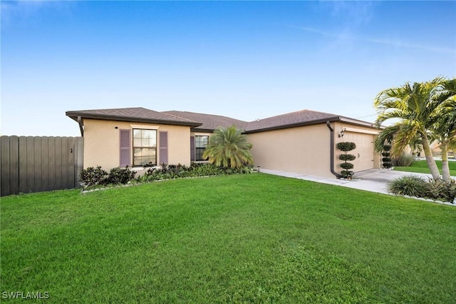 ranch-style house featuring a garage and a front yard