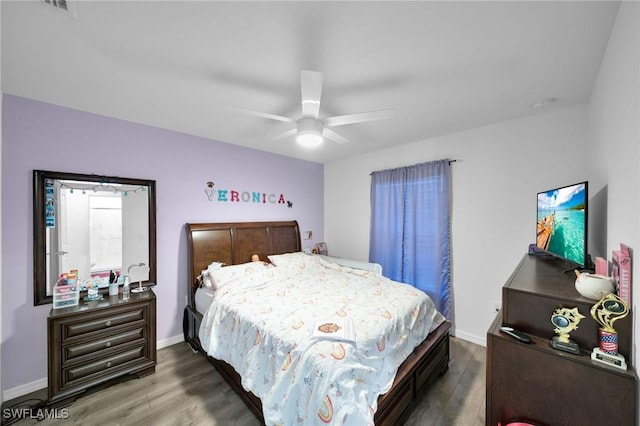 bedroom featuring ceiling fan and dark hardwood / wood-style floors