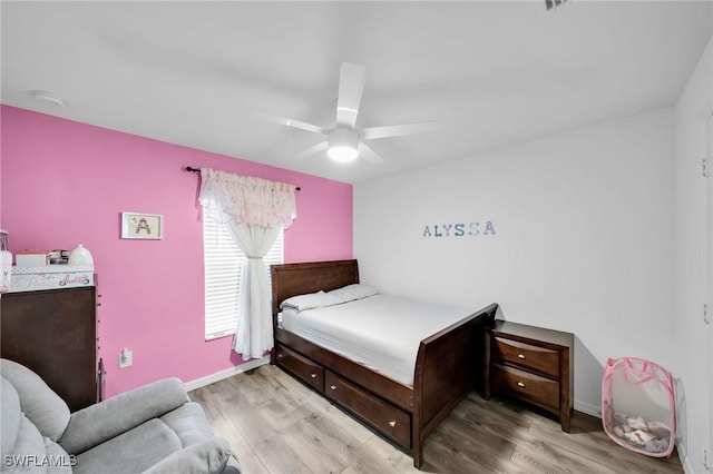 bedroom featuring light hardwood / wood-style floors and ceiling fan