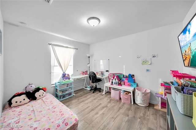 bedroom featuring light wood-type flooring