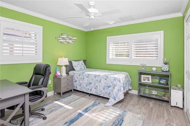 bedroom with a closet, ceiling fan, crown molding, and light wood-type flooring