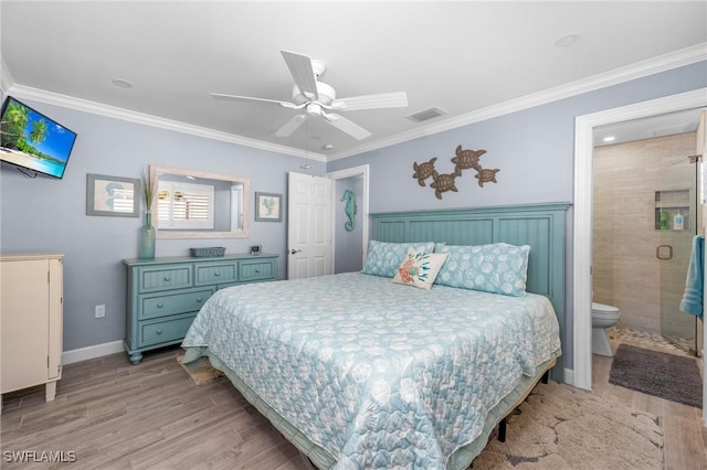 bedroom with ensuite bath, ceiling fan, light hardwood / wood-style flooring, and ornamental molding